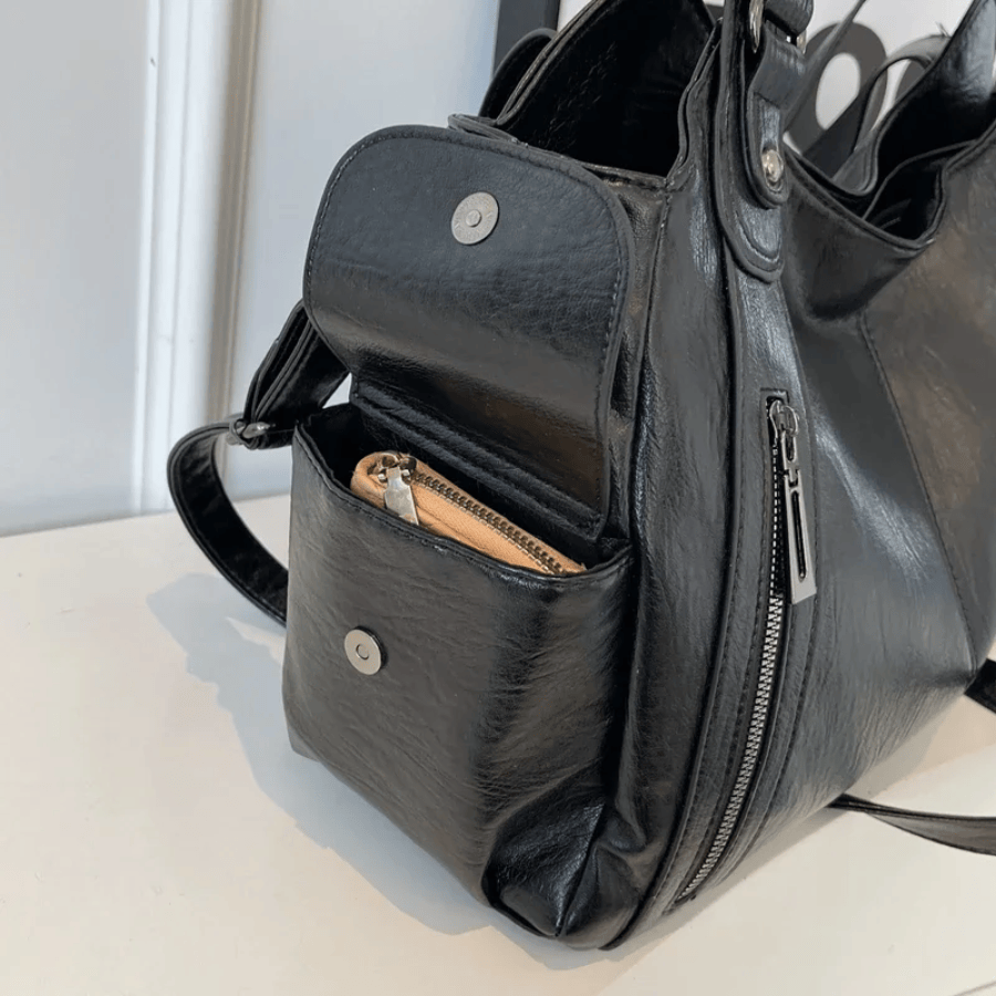 Celvera Compacte schoudertas met verstelbare band en stijlvol silhouet