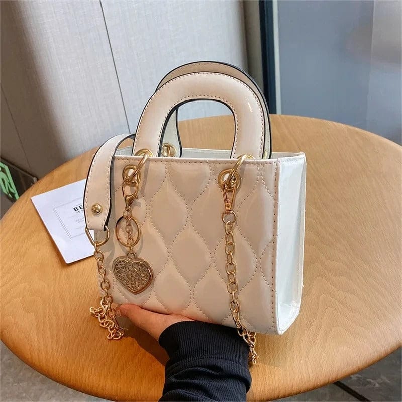 Celvera Tas Dames - Compacte Glanzende Handtas met Hartmotief en Gouden Hanger | Chique