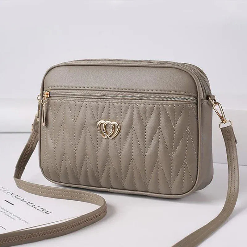 Celvera Tas Dames - Gewatteerde Crossbody met Hart Embleem en Rits | Casual